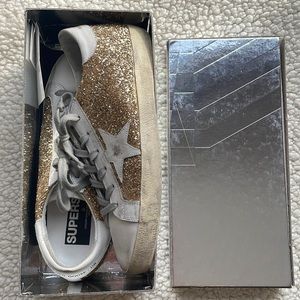 Brand new fabulous Golden Goose Superstar sneakers with gold glitter detail.